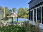 Pickle Ball Court is fenced in - to help keep the balls in yard and the competition moving